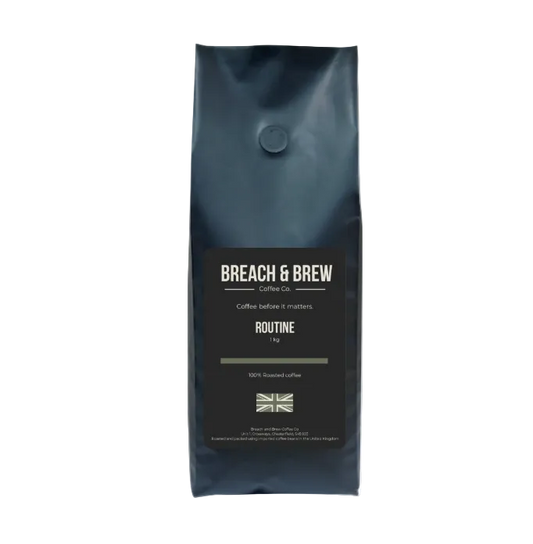 Black coffee bag with 'Breach & Brew' branding on a white background
