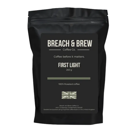 Black coffee bag with 'Breach & Brew' branding on a white background