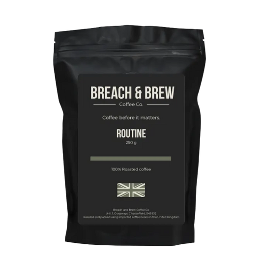 Black coffee bag with 'Breach & Brew' branding on a white background